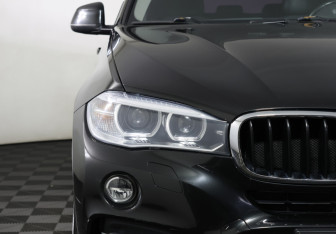 Подержанный автомобиль BMW X6 2015 года (24 фото)