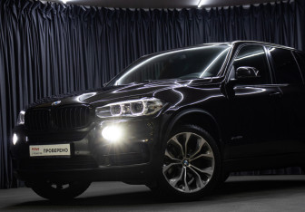 Подержанный автомобиль BMW X5 2014 года (22 фото)