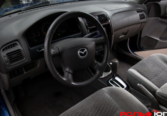 Подержанный автомобиль Mazda 626 Sedan 2001 года (13 фото)