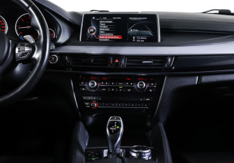 Подержанный автомобиль BMW X6 2016 года (14 фото)