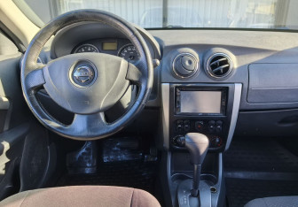 Подержанный автомобиль Nissan Almera Sedan 2014 года (14 фото)