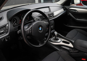 Подержанный автомобиль BMW X1 2014 года (12 фото)