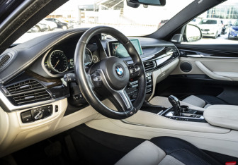 Подержанный автомобиль BMW X6 2015 года (13 фото)