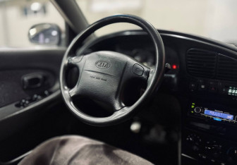 Подержанный автомобиль Kia Spectra Sedan 2006 года (12 фото)