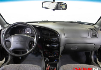 Подержанный автомобиль Kia Spectra Sedan 2006 года (10 фото)