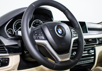 Подержанный автомобиль BMW X6 2016 года (14 фото)