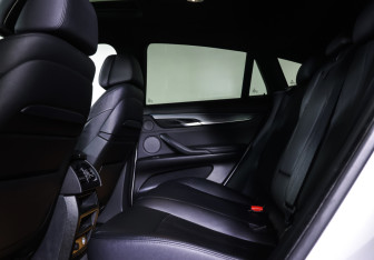 Подержанный автомобиль BMW X6 2016 года (12 фото)
