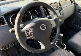 Подержанный автомобиль Nissan Tiida Sedan 2010 года (14 фото)