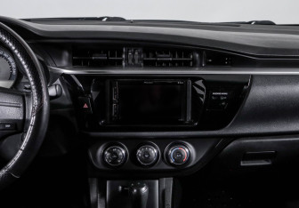 Подержанный автомобиль Toyota Corolla Sedan 2014 года (13 фото)