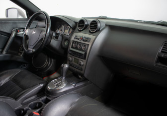 Подержанный автомобиль Hyundai Coupe 2008 года (9 фото)