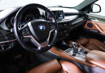 Подержанный автомобиль BMW X6 2015 года (14 фото)