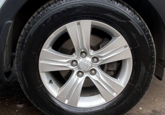 Подержанный автомобиль Kia Sportage 2011 года (14 фото)