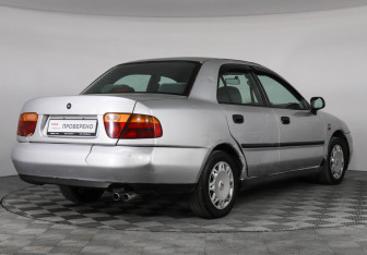Подержанный автомобиль Mitsubishi Carisma Sedan 1998 года (3 фото)