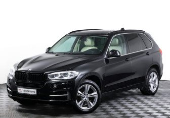 Подержанный автомобиль BMW X5 2014 года (23 фото)
