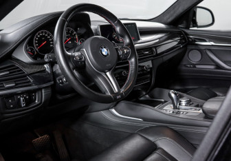 Подержанный автомобиль BMW X6 M 2015 года (14 фото)