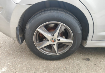 Подержанный автомобиль Nissan Tiida Hatchback 2011 года (12 фото)