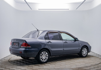 Подержанный автомобиль Mitsubishi Lancer Sedan 2009 года (5 фото)