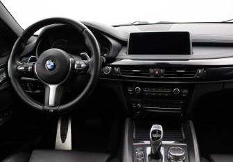 Подержанный автомобиль BMW X6 2015 года (13 фото)