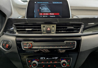 Подержанный автомобиль BMW X1 2018 года (15 фото)