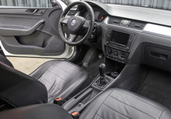 Подержанный автомобиль Skoda Rapid Liftback 2014 года (11 фото)