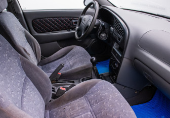 Подержанный автомобиль Kia Spectra Sedan 2006 года (9 фото)