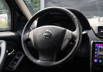 Подержанный автомобиль Nissan Terrano 2014 года (10 фото)