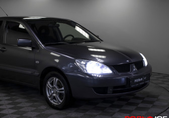 Подержанный автомобиль Mitsubishi Lancer Sedan 2009 года (20 фото)