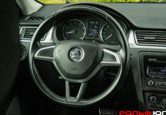 Подержанный автомобиль Skoda Rapid Liftback 2014 года (11 фото)