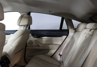 Подержанный автомобиль BMW X6 2015 года (14 фото)