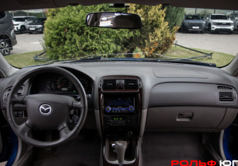 Подержанный автомобиль Mazda 626 Sedan 2001 года (10 фото)