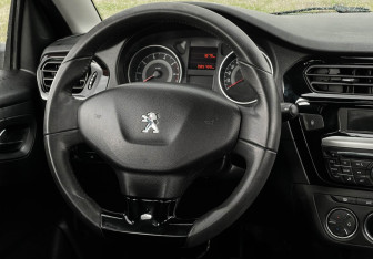Подержанный автомобиль Peugeot 301 2013 года (14 фото)
