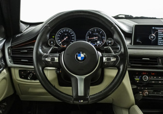 Подержанный автомобиль BMW X6 2015 года (11 фото)