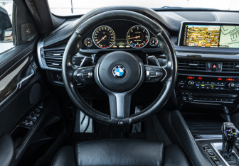 Подержанный автомобиль BMW X6 2016 года (10 фото)