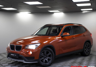 Подержанный автомобиль BMW X1 2014 года (22 фото)