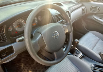 Подержанный автомобиль Nissan Almera Classic 2007 года (12 фото)