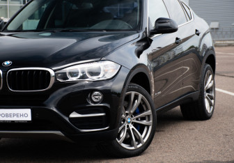 Подержанный автомобиль BMW X6 2015 года (23 фото)