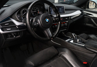 Подержанный автомобиль BMW X6 2016 года (11 фото)