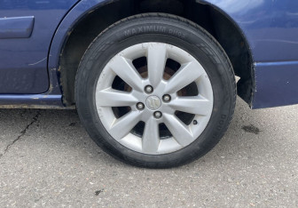 Подержанный автомобиль Suzuki Liana Wagon 2005 года (12 фото)