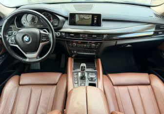 Подержанный автомобиль BMW X6 2015 года (9 фото)