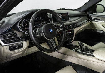 Подержанный автомобиль BMW X6 2015 года (10 фото)