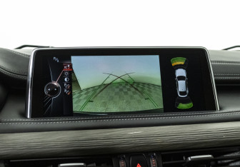 Подержанный автомобиль BMW X6 2015 года (18 фото)