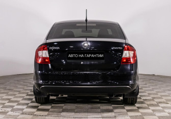 Подержанный автомобиль Skoda Rapid Liftback 2014 года (4 фото)