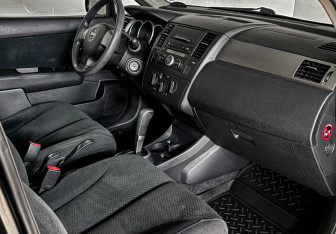 Подержанный автомобиль Nissan Tiida Sedan 2013 года (11 фото)