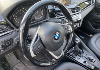 Подержанный автомобиль BMW X1 2016 года (14 фото)