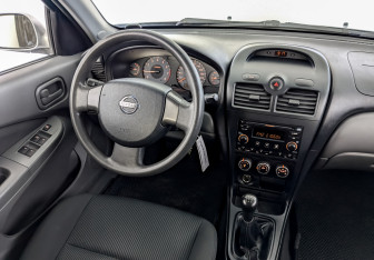 Подержанный автомобиль Nissan Almera Classic 2009 года (26 фото)