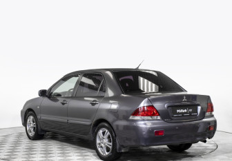Подержанный автомобиль Mitsubishi Lancer Sedan 2009 года (7 фото)