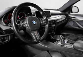 Подержанный автомобиль BMW X6 2018 года (14 фото)