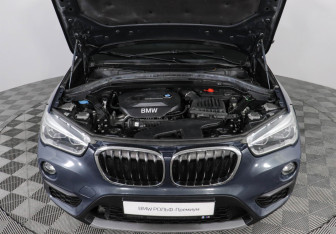 Подержанный автомобиль BMW X1 2016 года (10 фото)