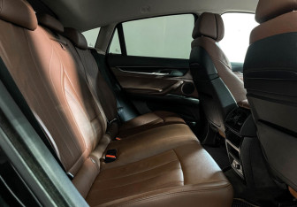 Подержанный автомобиль BMW X6 2016 года (14 фото)
