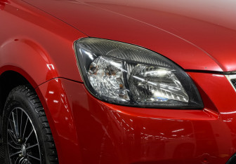 Подержанный автомобиль Kia Rio Sedan 2010 года (13 фото)